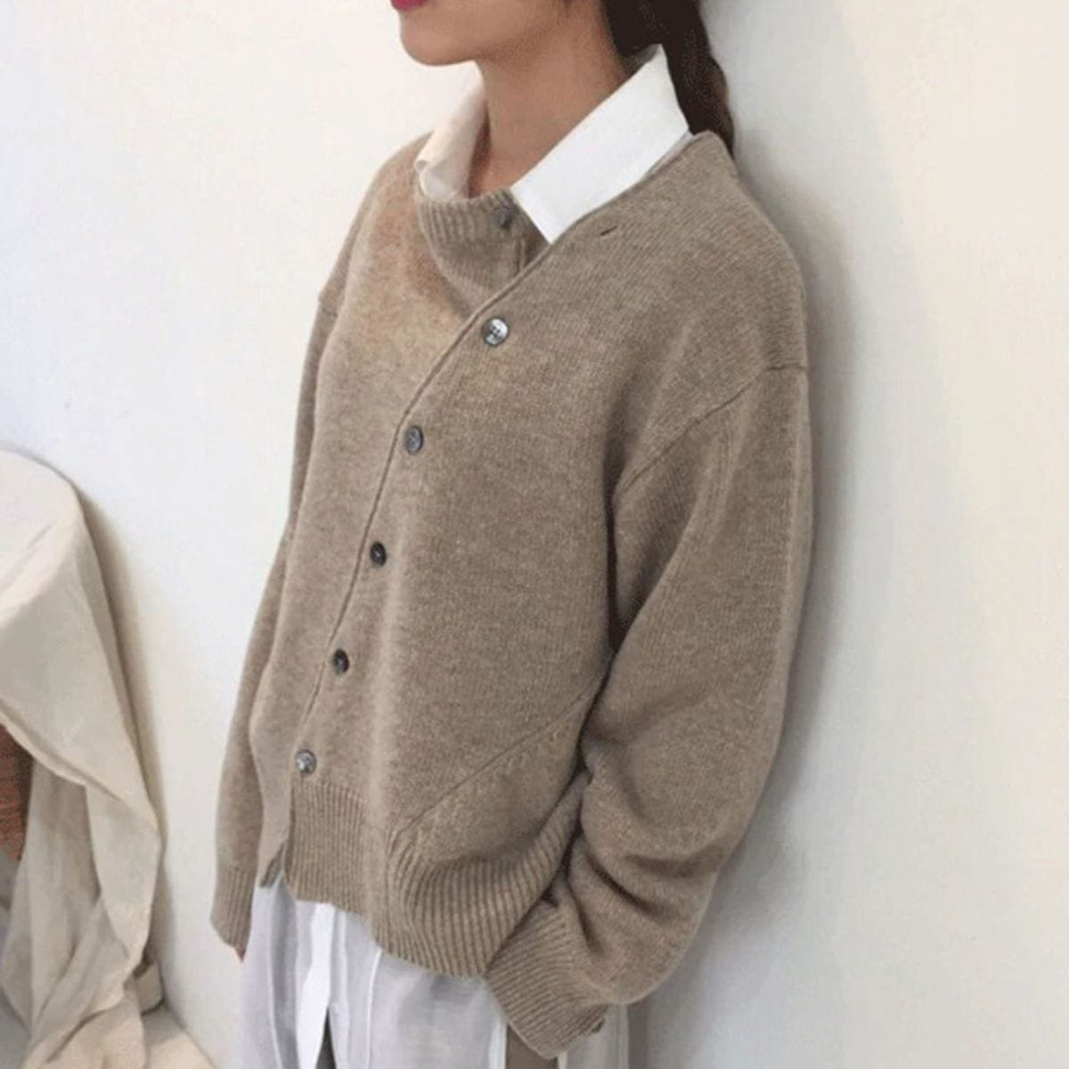 Women's oversized asymmetric button cardigan with long sleeves and ribbed trims