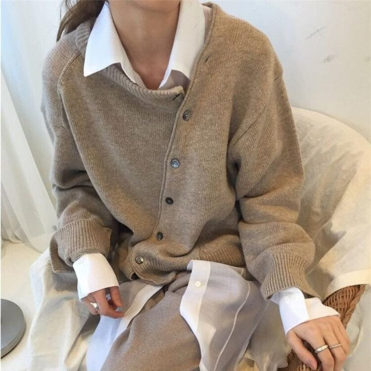 Women's oversized asymmetric button cardigan with long sleeves and ribbed trims