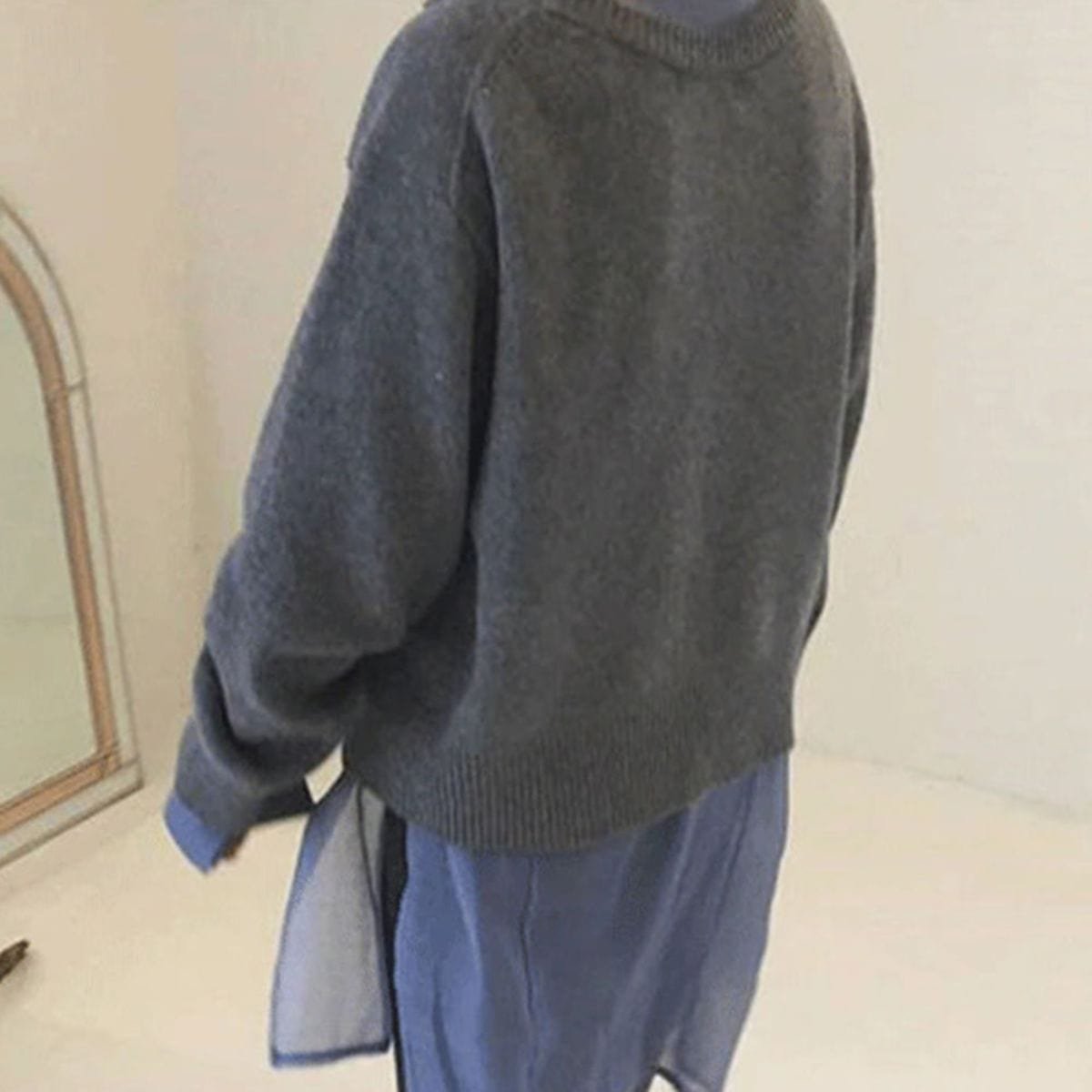 Women's oversized asymmetric button cardigan with long sleeves and ribbed trims
