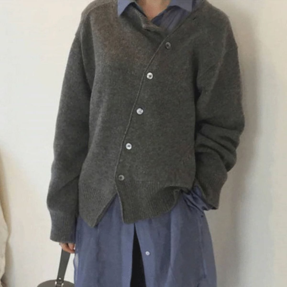 Women's oversized asymmetric button cardigan with long sleeves and ribbed trims