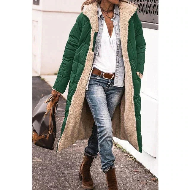 Woman wearing a long hooded quilted puffer coat with contrasting textured trim
