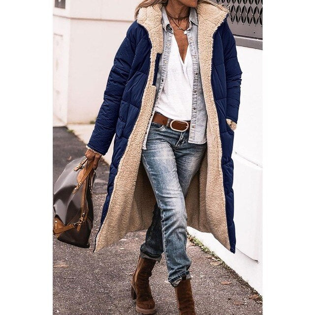 Woman wearing a long hooded quilted puffer coat with contrasting textured trim