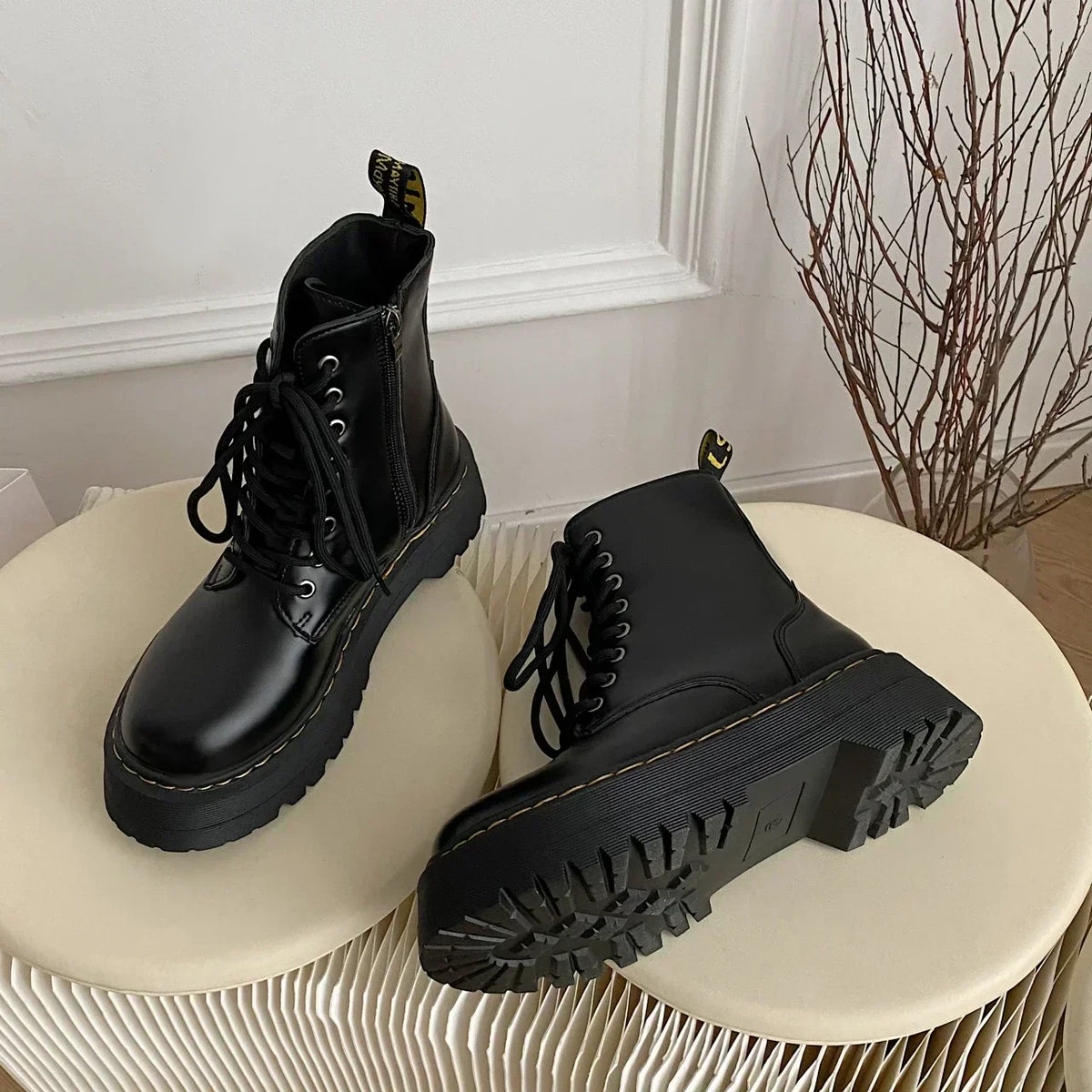 Women's black lace-up combat ankle boots with platform soles