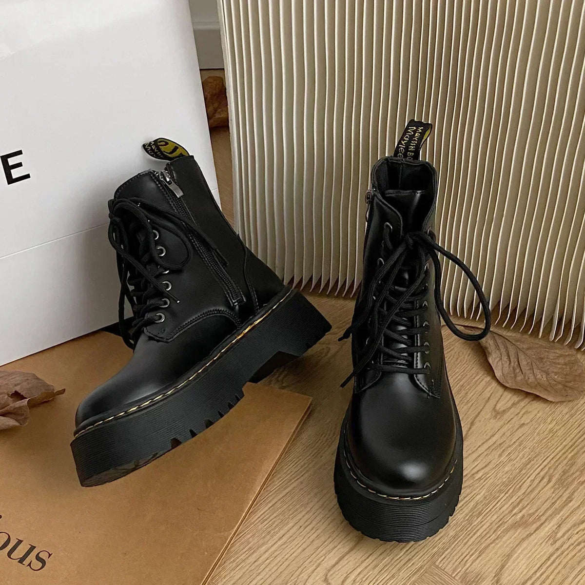 Women's black lace-up combat ankle boots with platform soles