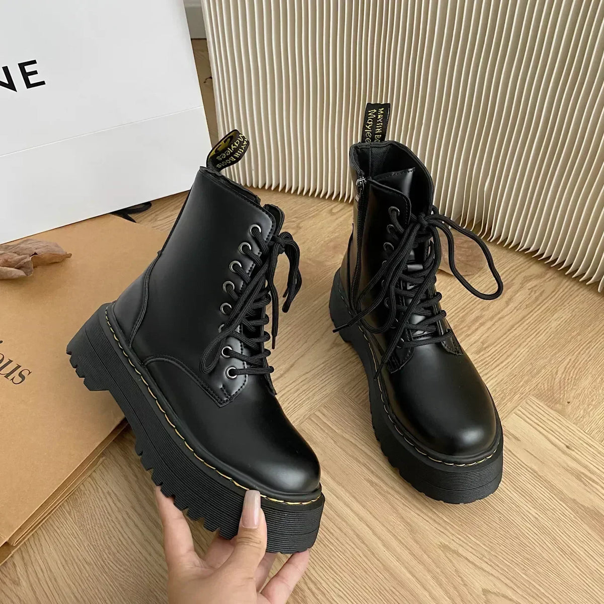 Women's black lace-up combat ankle boots with platform soles