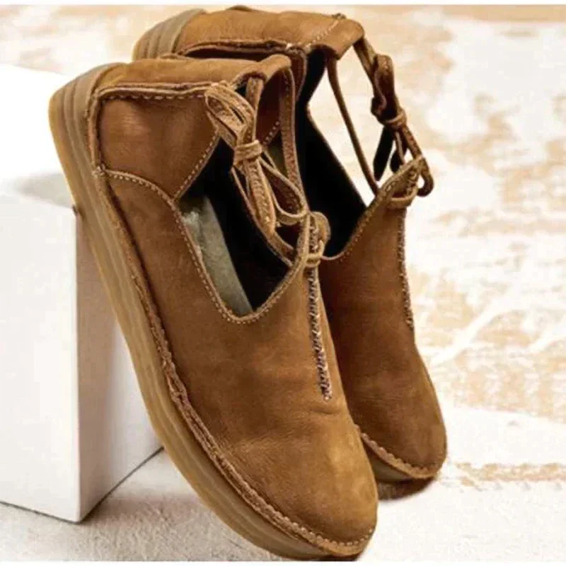 Women's ankle boots with round toes, stitched edging and side ties