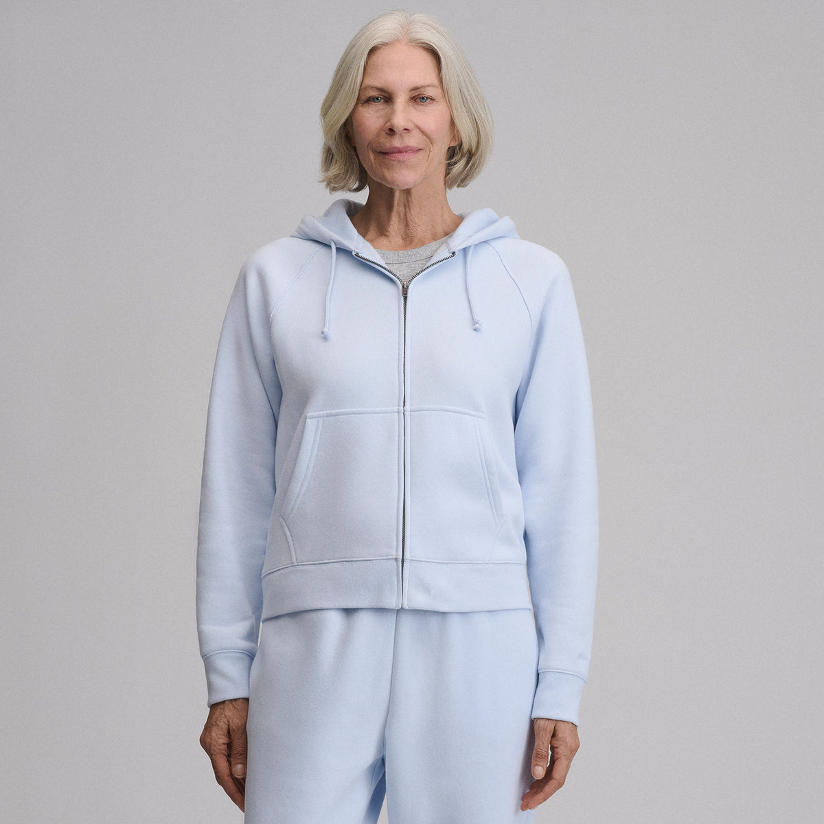 Women's full-zip hooded sweatshirt with long sleeves and front pouch pockets
