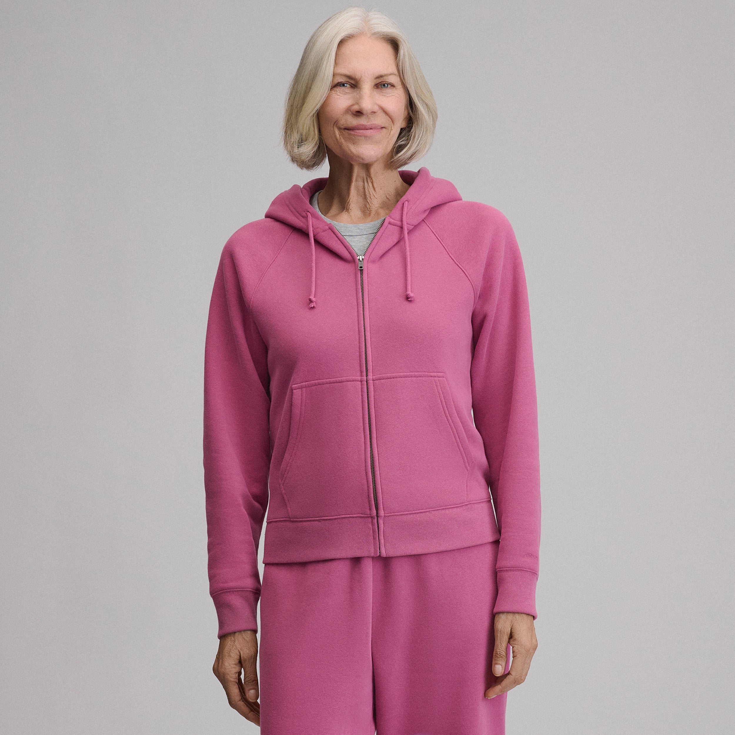 Women's full-zip hooded sweatshirt with long sleeves and front pouch pockets