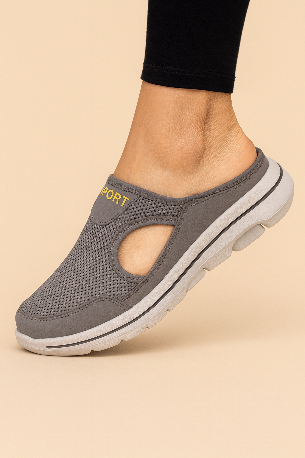 Women's slip-on athletic shoe with mesh panels and layered sole