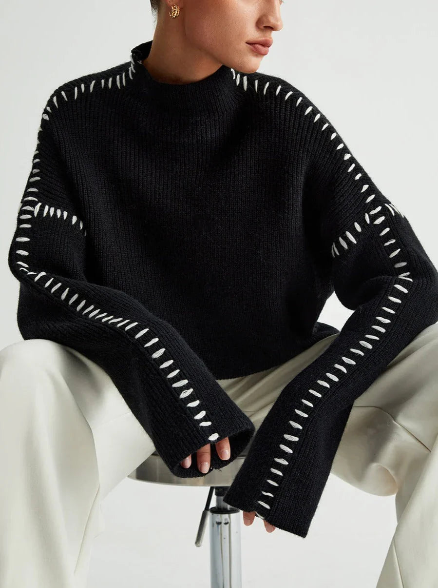Women's ribbed knit sweater with contrasting stitch trim and long sleeves