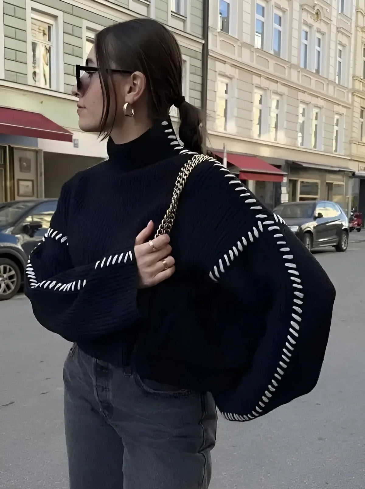 Women's ribbed knit sweater with contrasting stitch trim and long sleeves