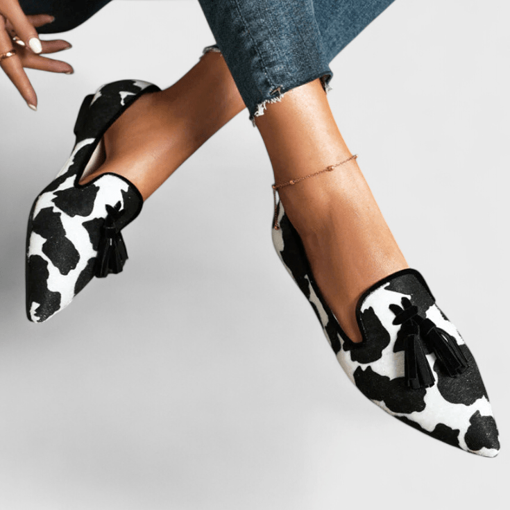 Women's pointed animal print loafers with tassel detailing