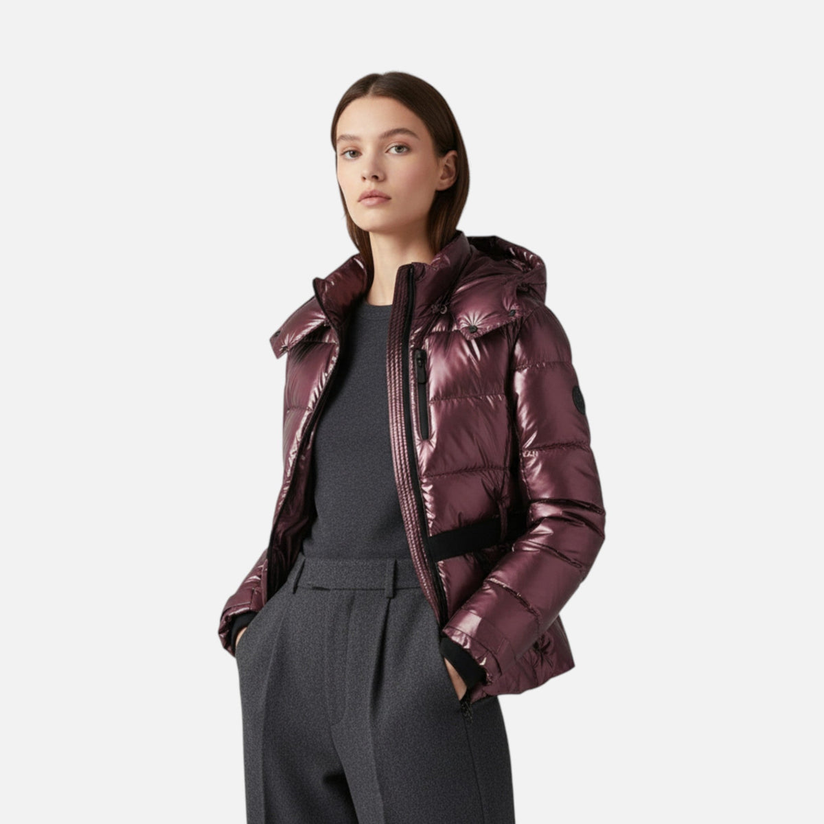 Women's hooded padded ski jacket with cinched waist, long sleeves and zipped pockets