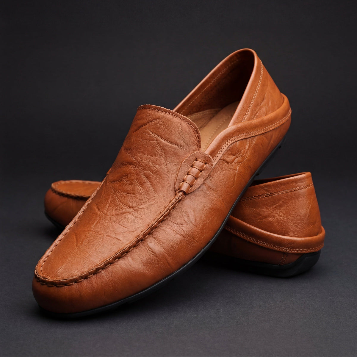 Men's moc toe slip-on loafers with stitched trim and flat soles