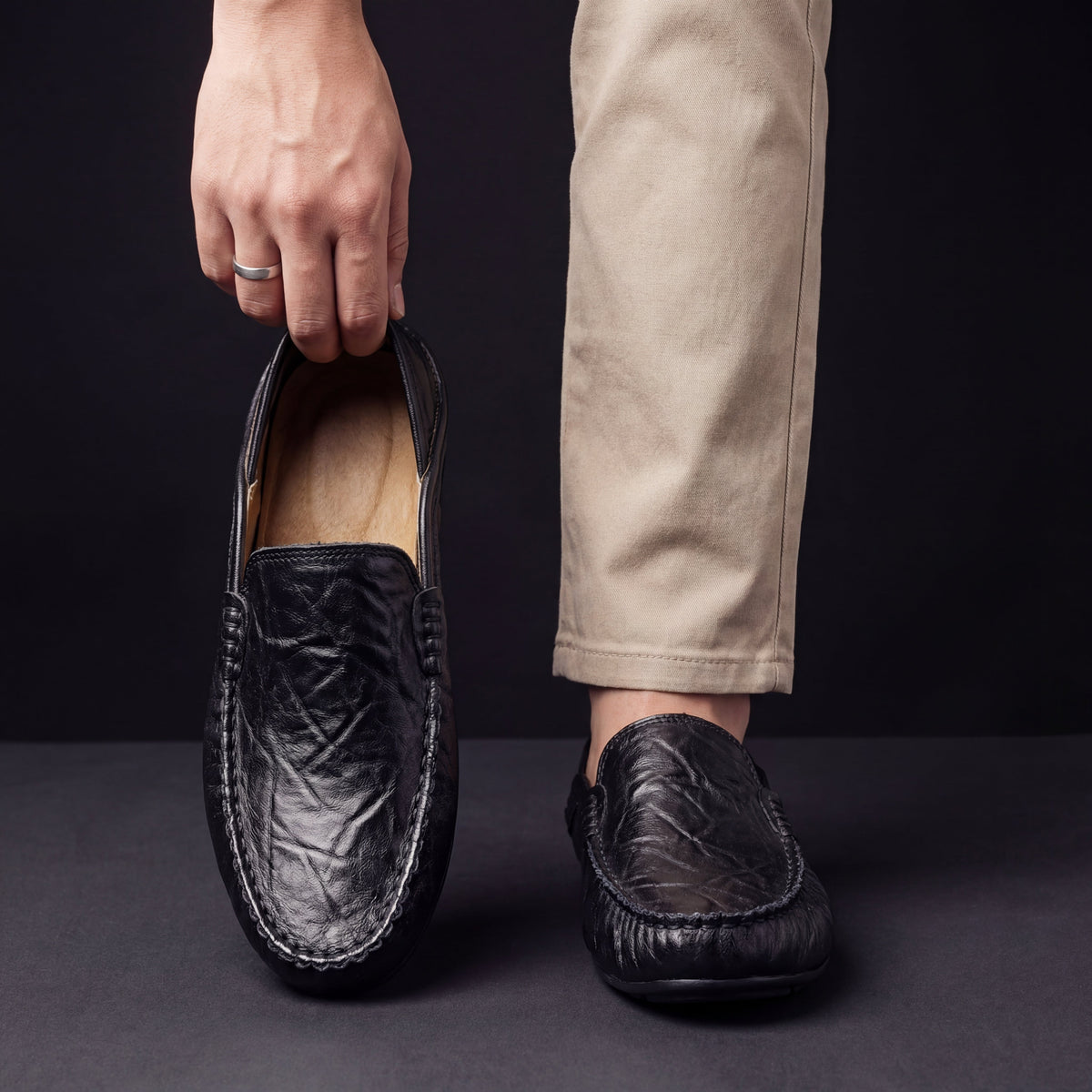 Men's moc toe slip-on loafers with stitched trim and flat soles