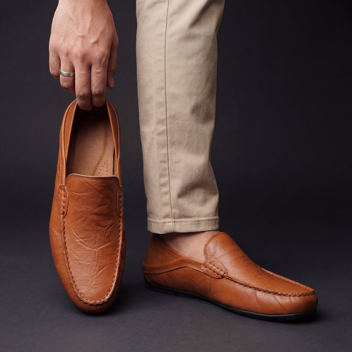 Men's moc toe slip-on loafers with stitched trim and flat soles