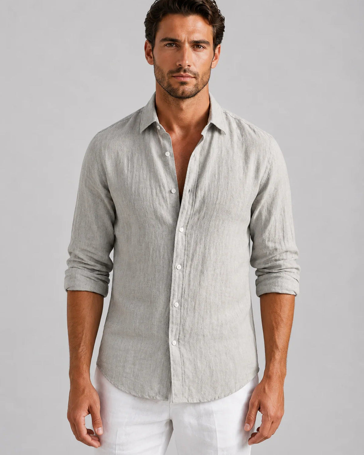 Men's long-sleeve textured button-up shirt with spread collar and curved hem