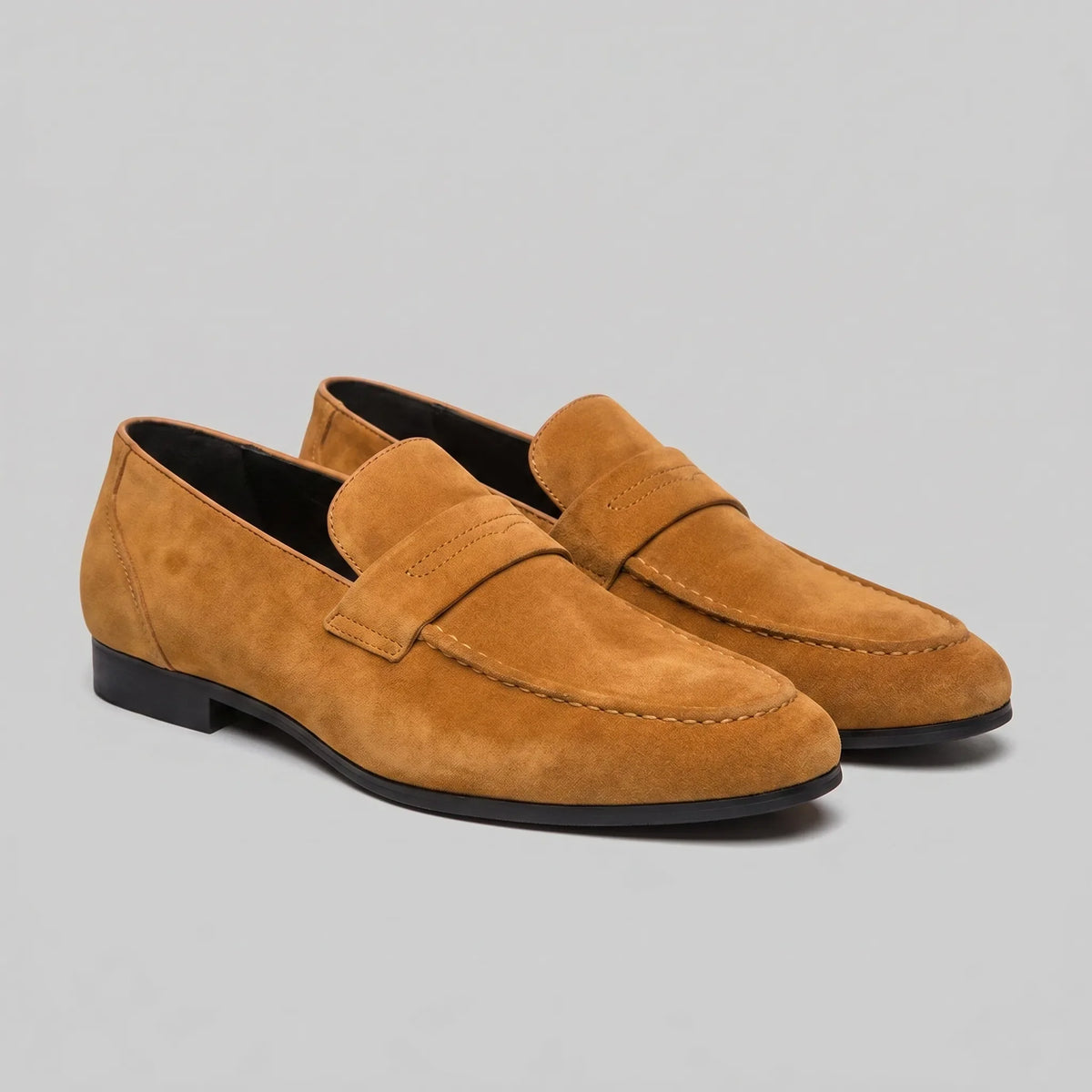 Men's penny loafers with closed backs, raised vamp straps and low flat heels