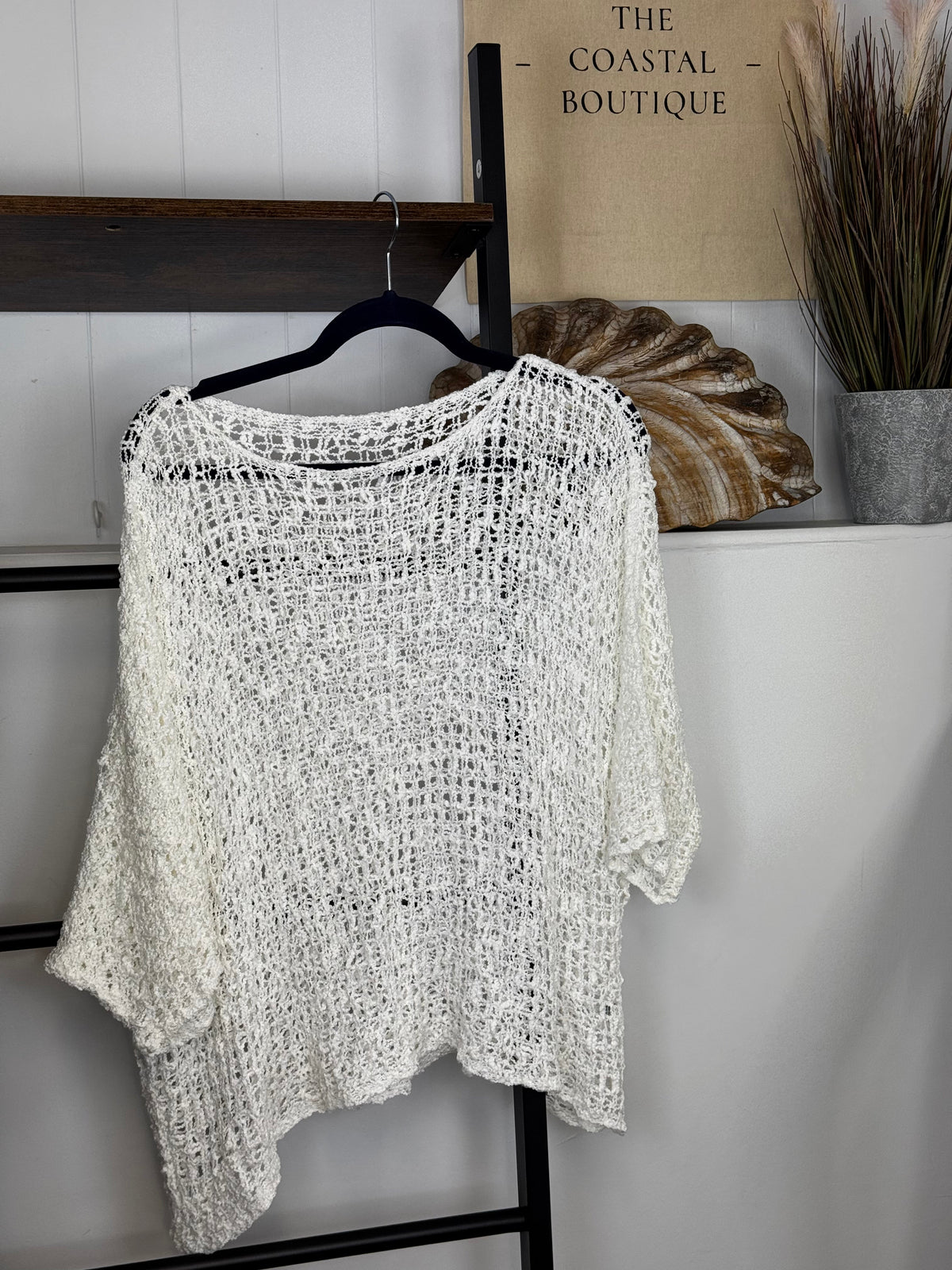 Women's open-knit textured poncho with round neckline and loose batwing sleeves