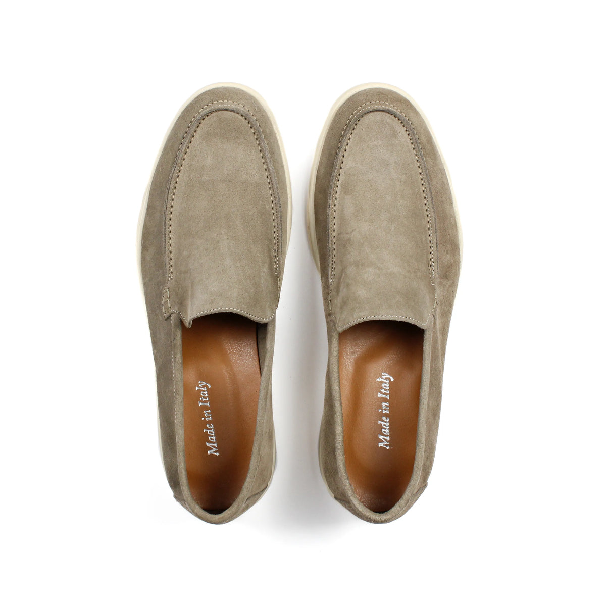 Men's beige slip-on loafers with moc toe stitching and cream soles