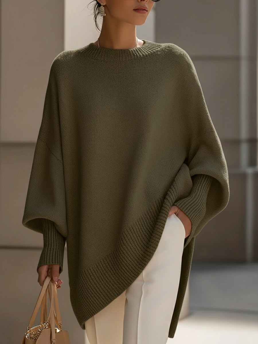 Women's oversized plain crew neck sweater with long sleeves and asymmetric hem