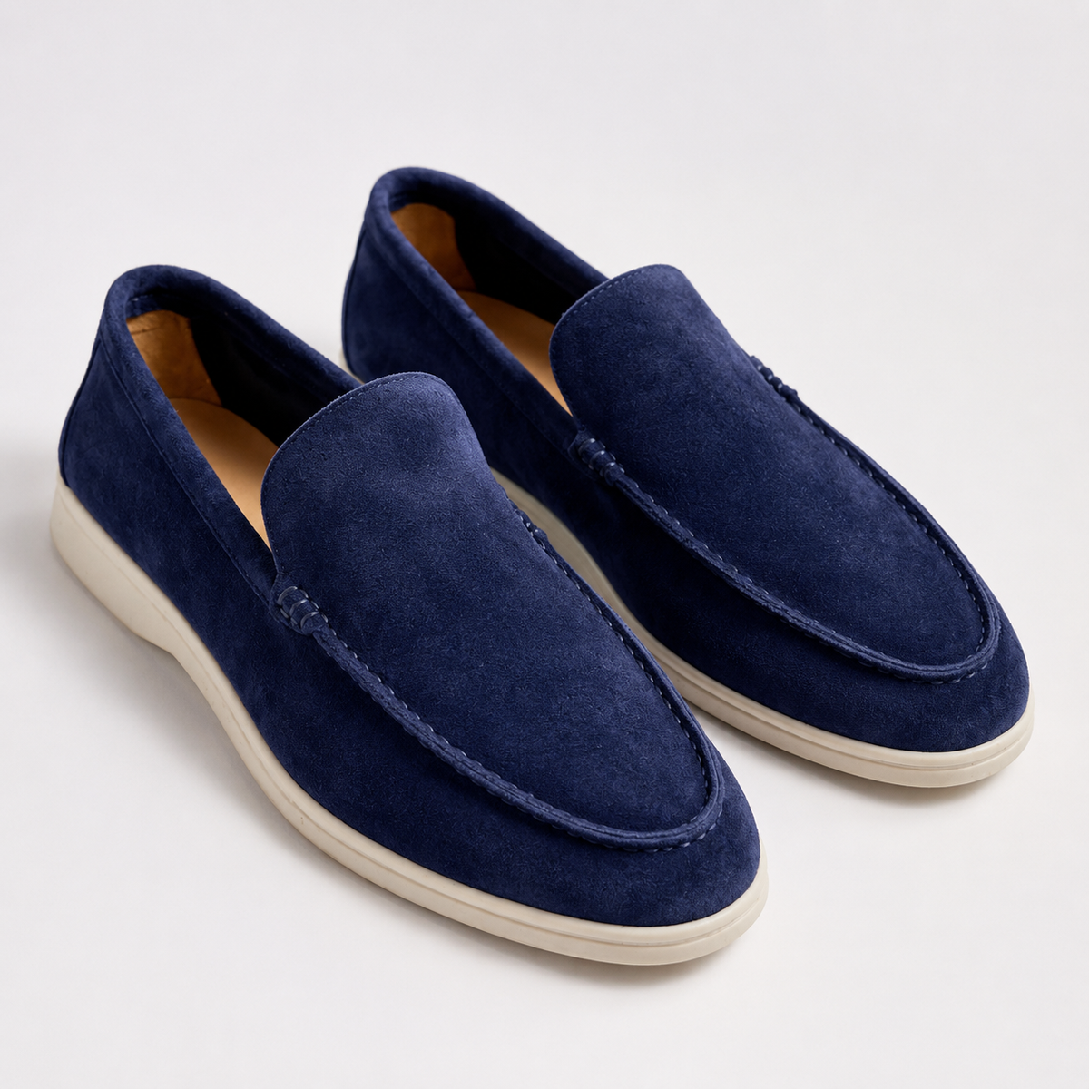 Men's round-toe slip-on loafers with moccasin stitching and low flat soles