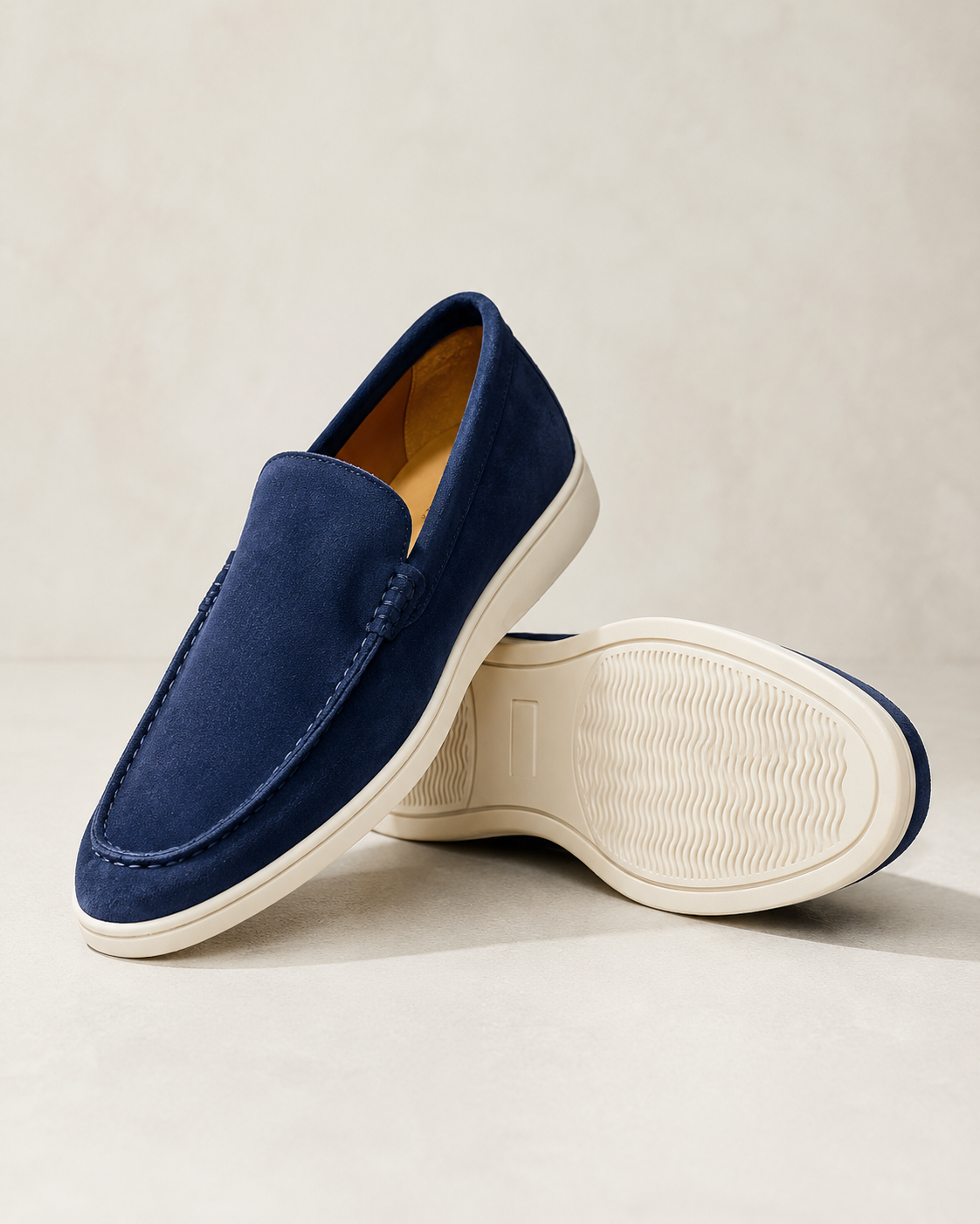 Men's round-toe slip-on loafers with moccasin stitching and low flat soles
