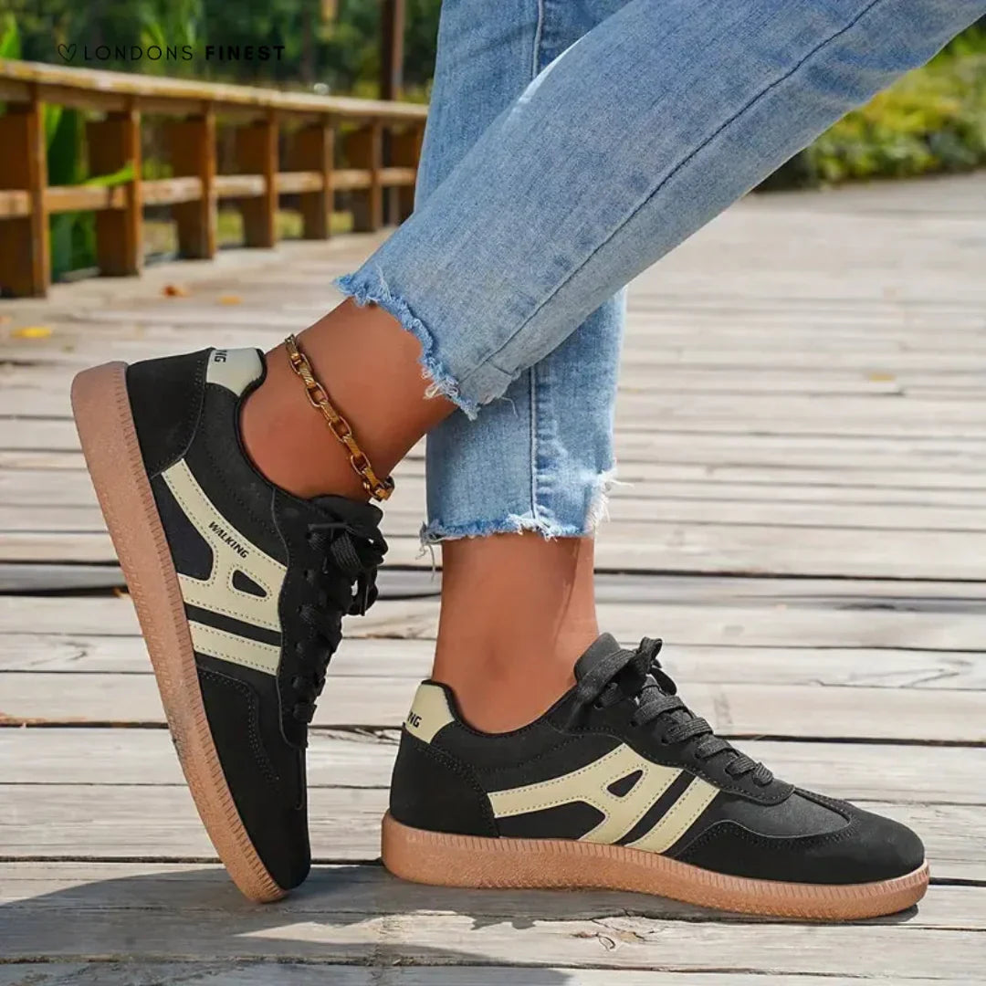 Women's low-top lace-up trainers with contrast side stripes and flat gum-effect soles
