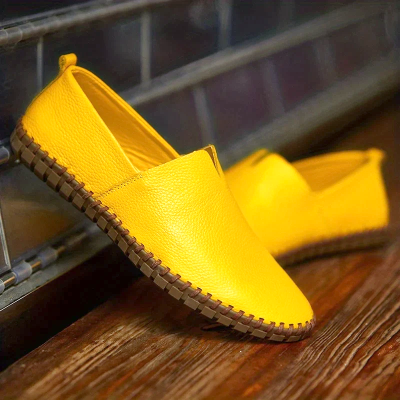 Men's textured slip-on loafer with contrasting stitched trim and flat treaded sole