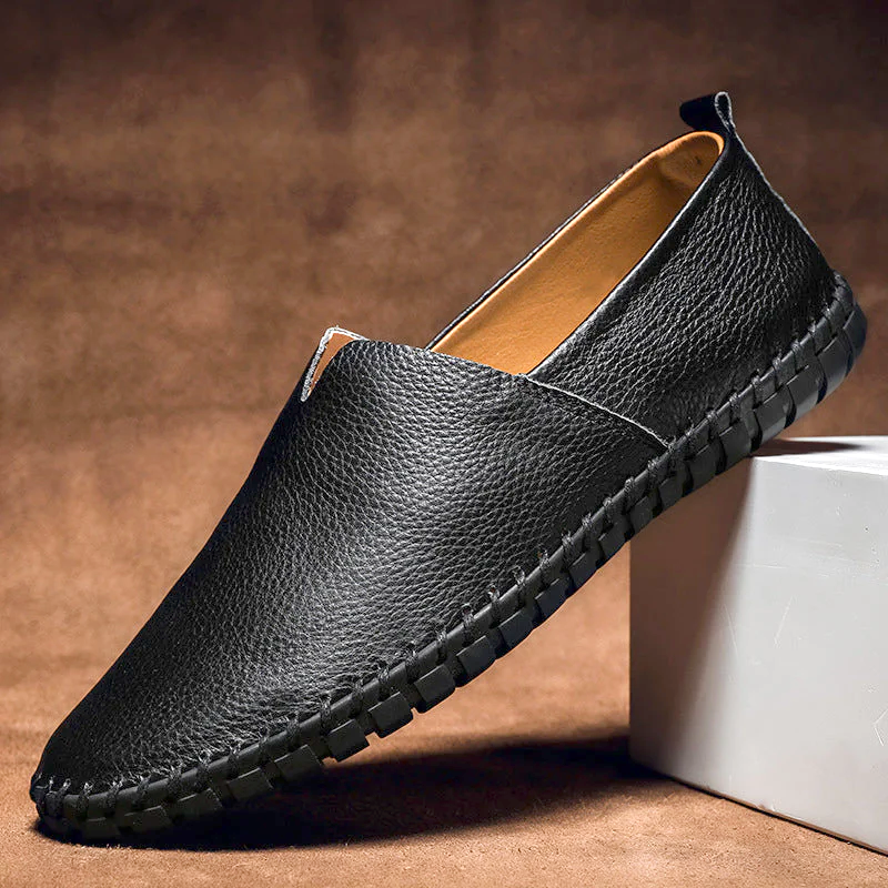 Men's textured slip-on loafer with contrasting stitched trim and flat treaded sole