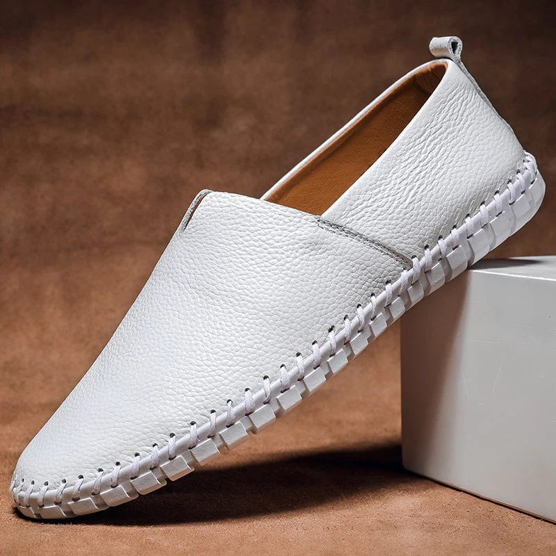 Men's textured slip-on loafer with contrasting stitched trim and flat treaded sole