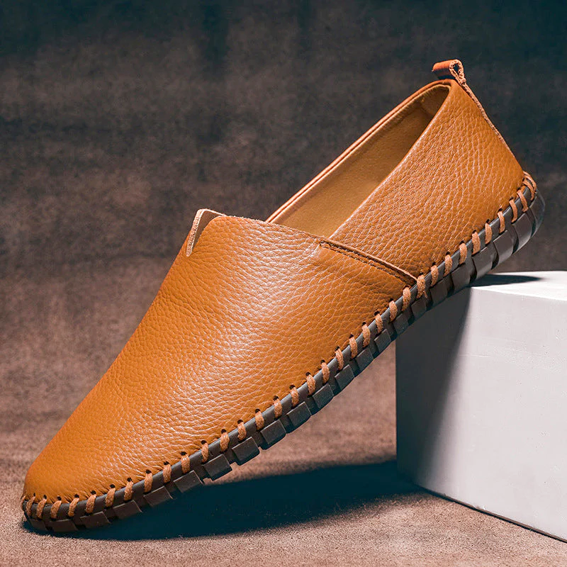 Men's textured slip-on loafer with contrasting stitched trim and flat treaded sole