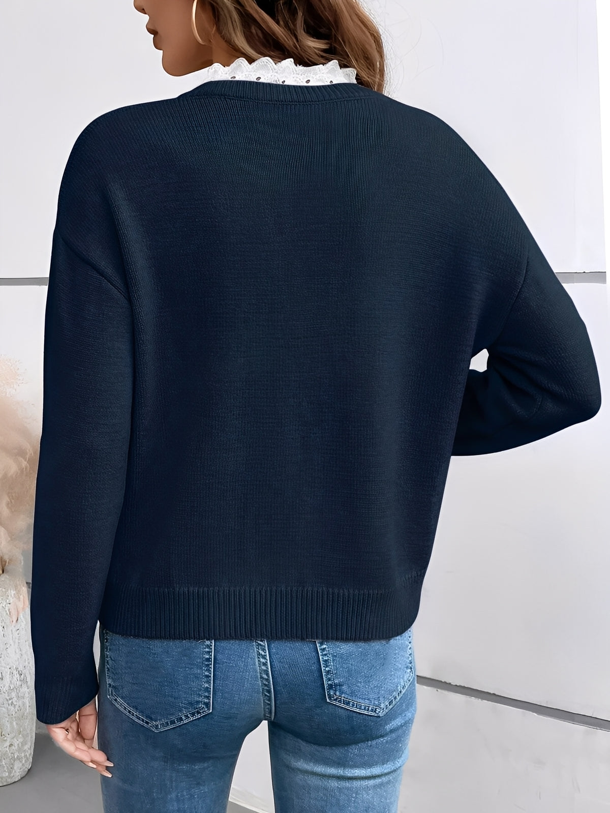 Women's ribbed V-neck sweater with contrasting lace neckline and long sleeves
