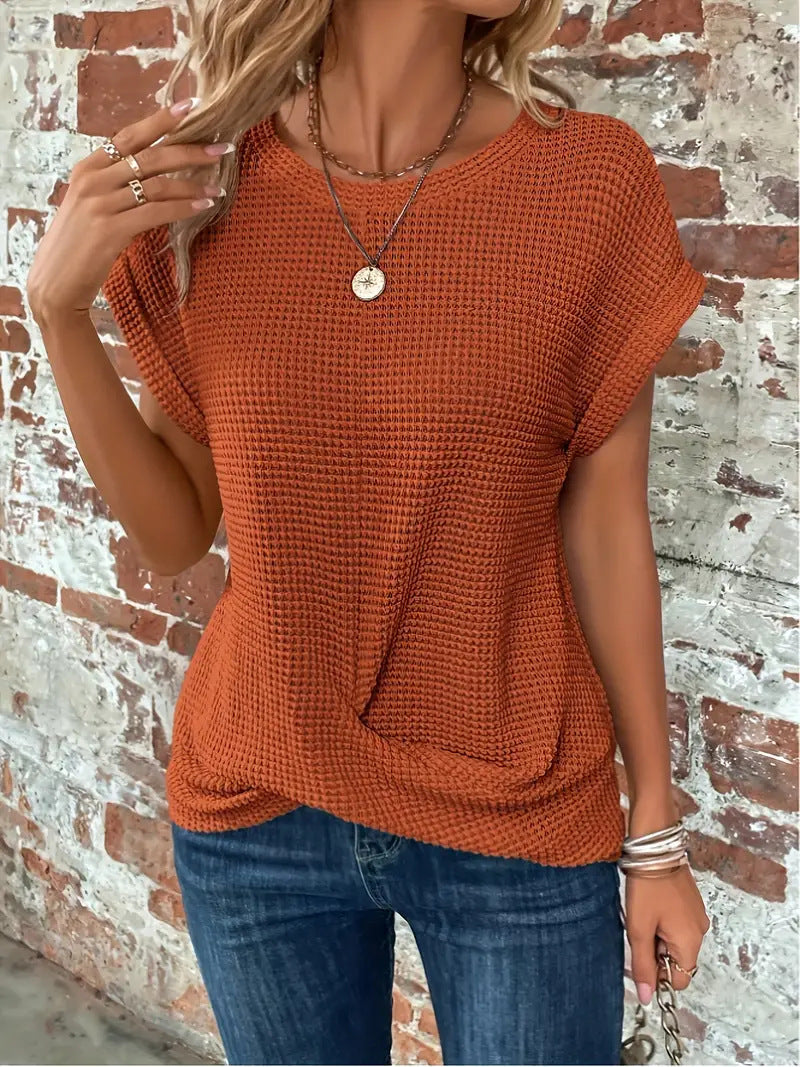 Women's short-sleeve waffle-knit top with a crew neckline and front pocket