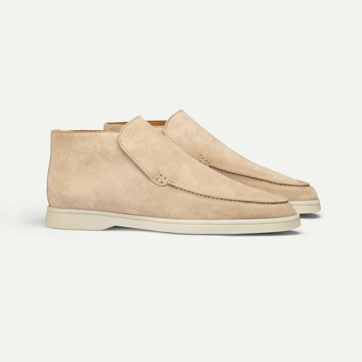 Men's ankle loafer boots with stitched vamp detail and flat light-coloured soles