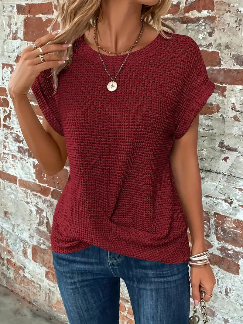 Women's short-sleeve waffle-knit top with a crew neckline and front pocket