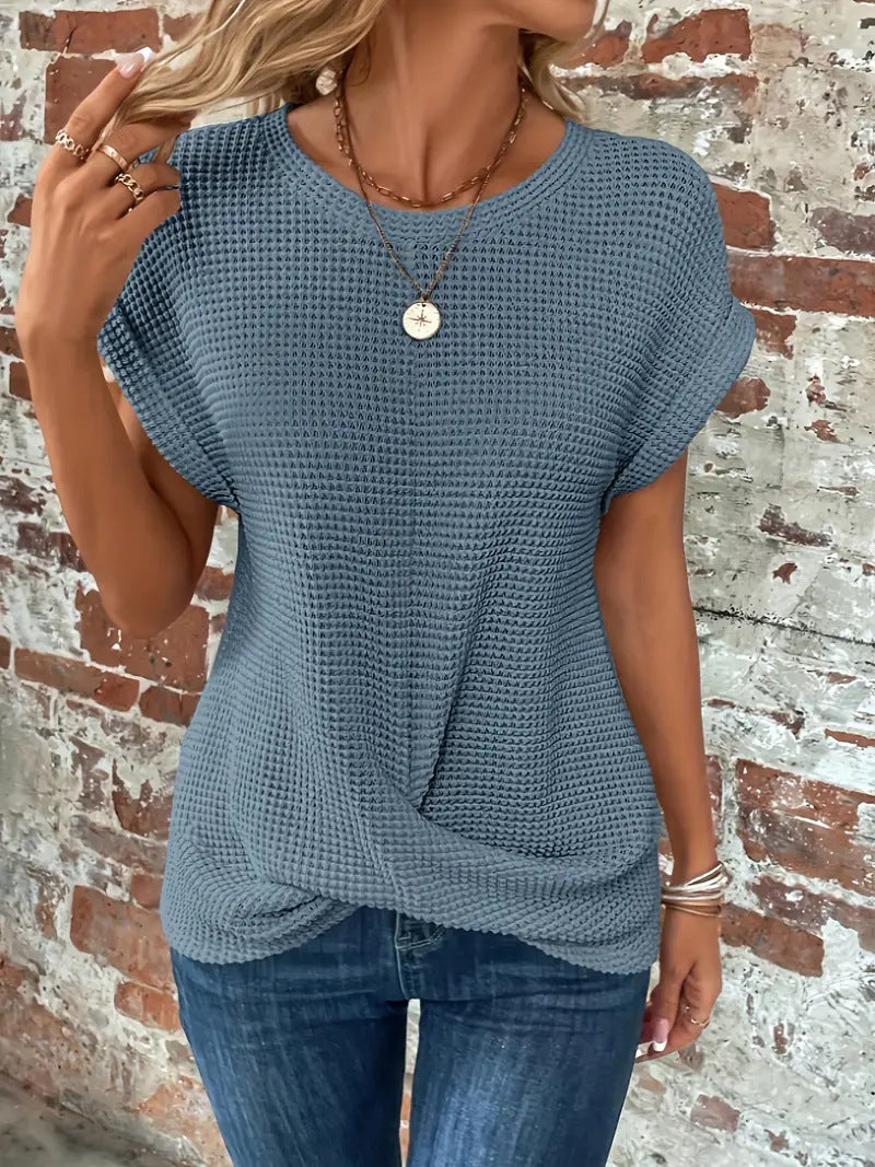 Women's short-sleeve waffle-knit top with a crew neckline and front pocket