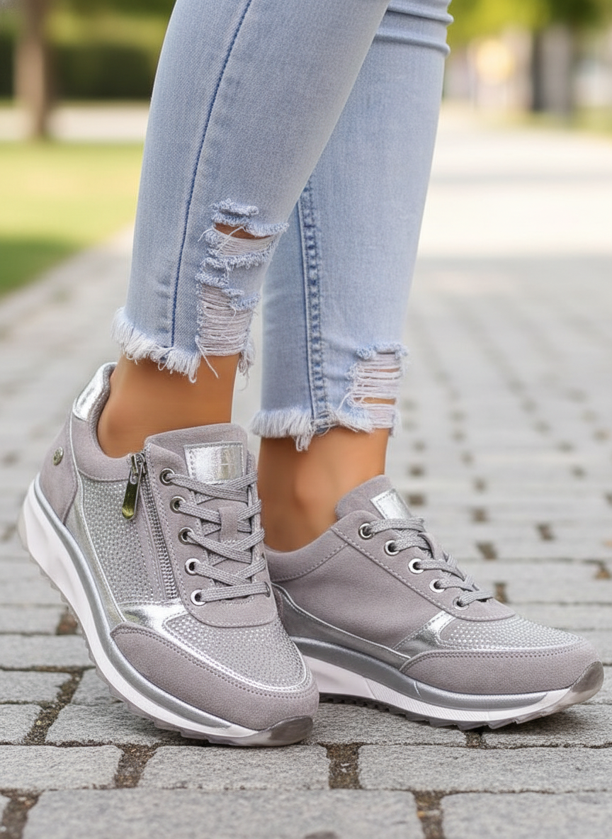 Women's low-top lace-up sneakers with metallic panel details and raised soles
