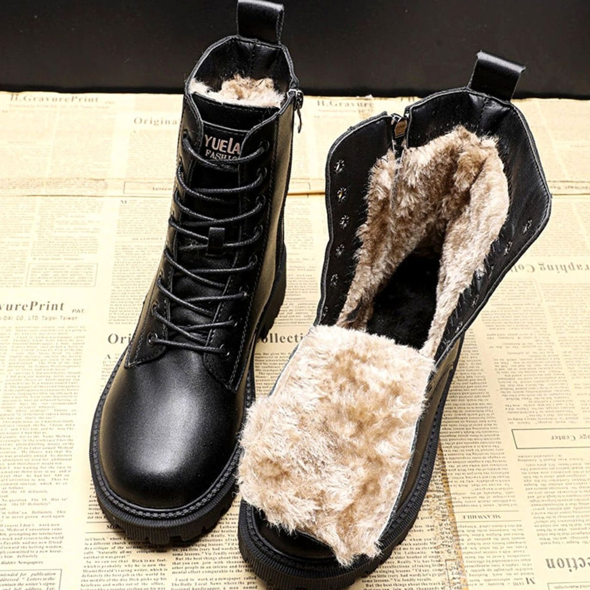 Women's black fur-lined lace-up ankle boots with side zip and flat treaded soles