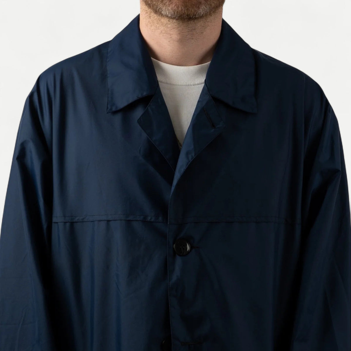 Men's navy long raincoat with pointed collar and button front