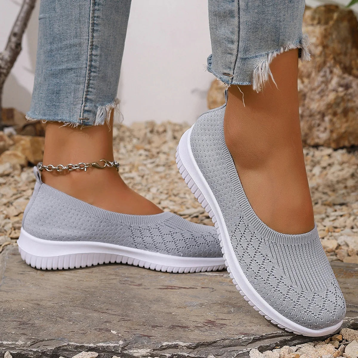 Women's geometric knit slip-on shoes with closed round toes and white ridged soles