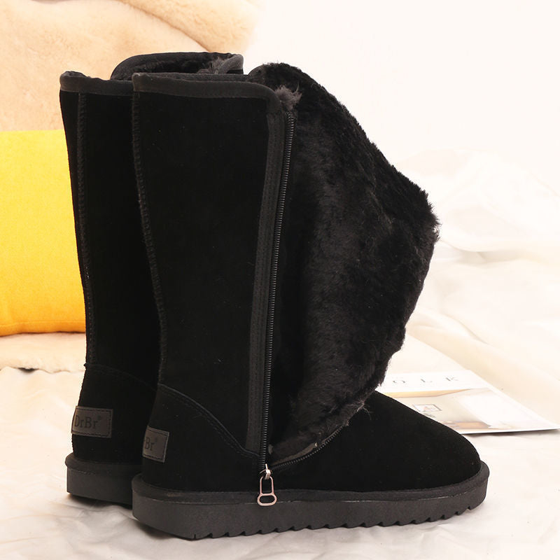Black tall winter boots with faux-fur trim, side zips and ridged flat soles