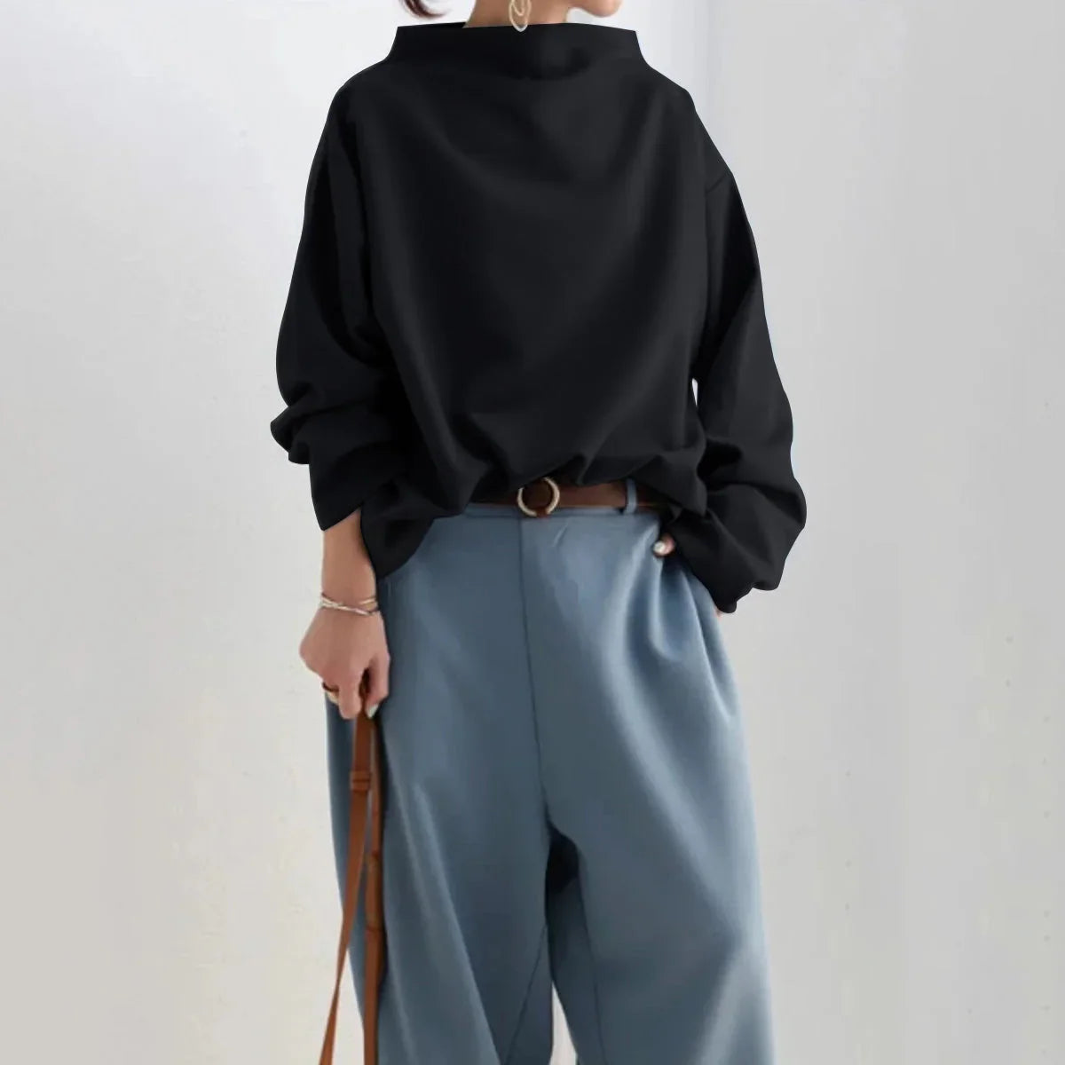 Women's black oversized jumper with mock neckline and long sleeves