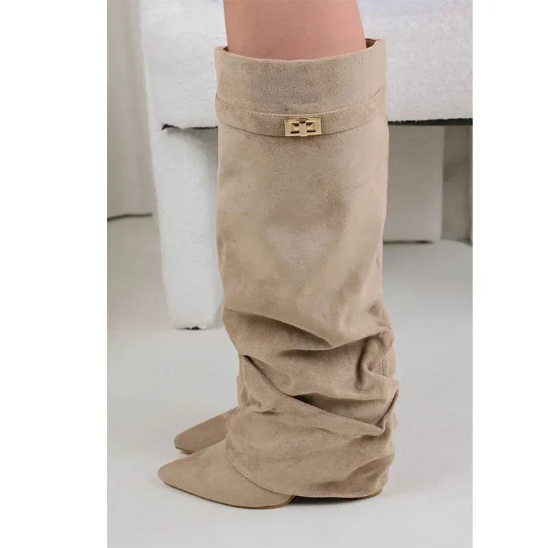 Women's slouch knee-high boots with pointed toes, low heels and buckle strap detail