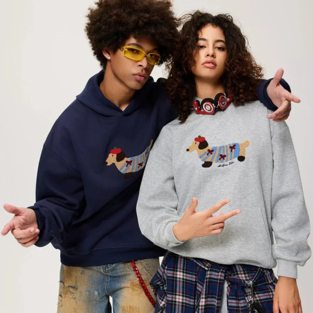 Women's hooded sweatshirt with embroidered dog graphic, long sleeves and kangaroo pocket
