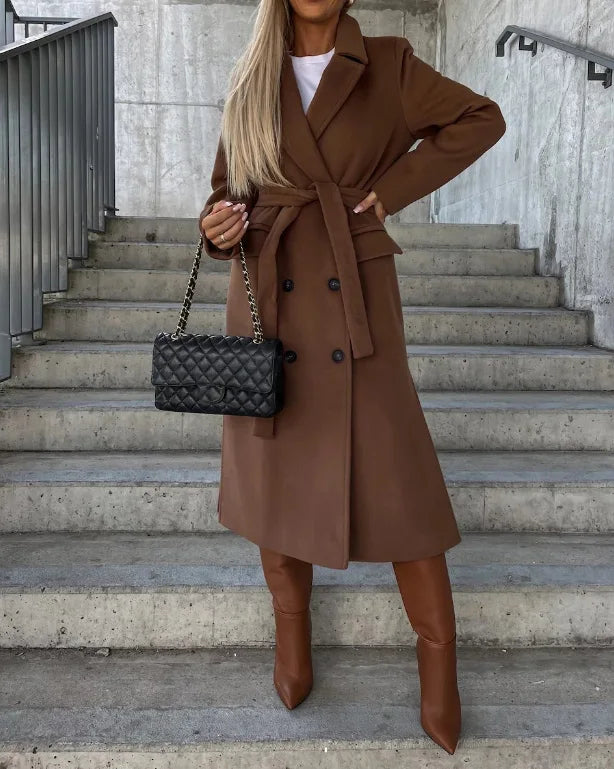 Women's longline belted double-breasted trench coat with lapel collar and long sleeves