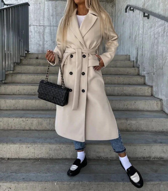 Women's longline belted double-breasted trench coat with lapel collar and long sleeves
