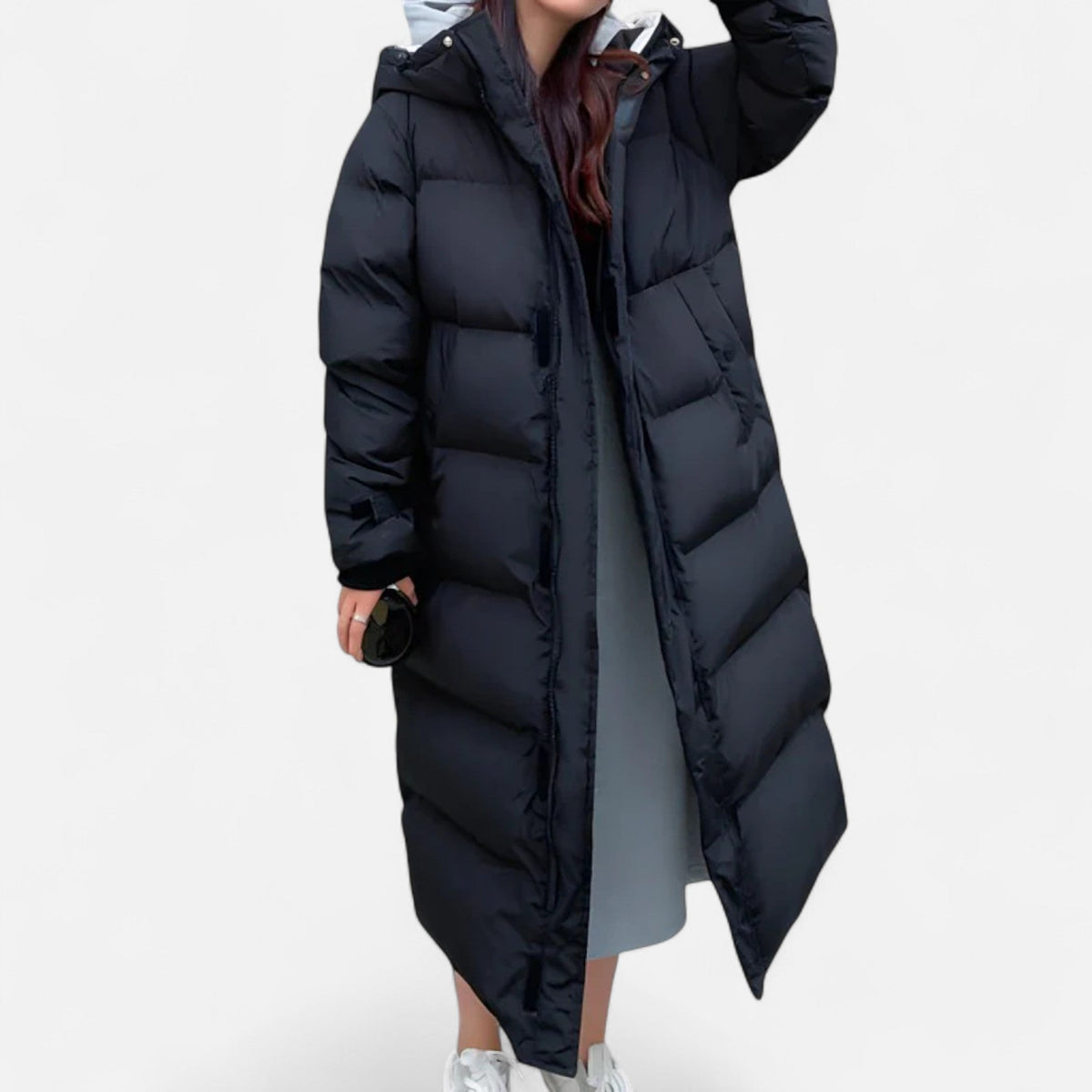 Women's long quilted hooded puffer coat shown in white and black