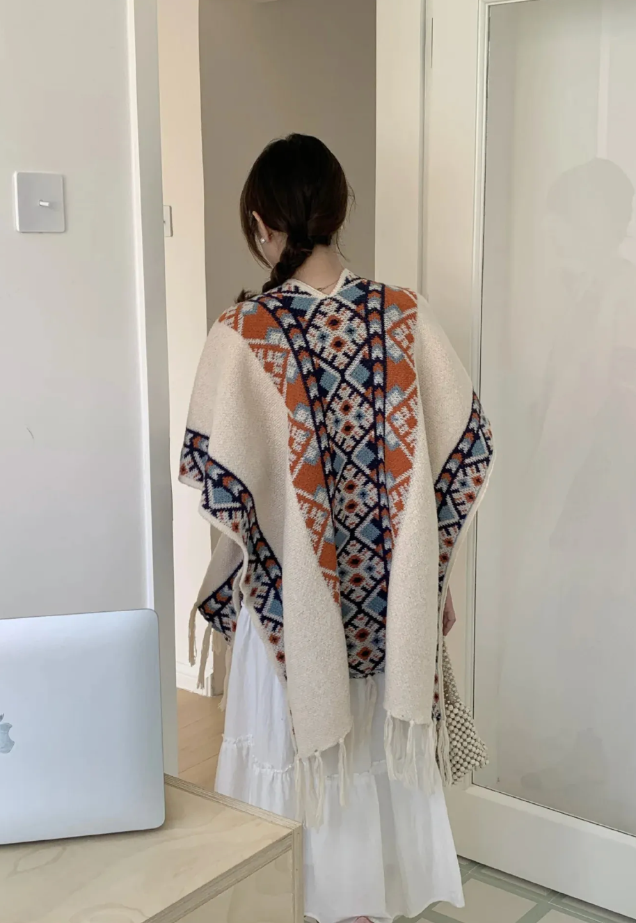 Women's geometric patterned cardigan with short sleeves and fringed edges
