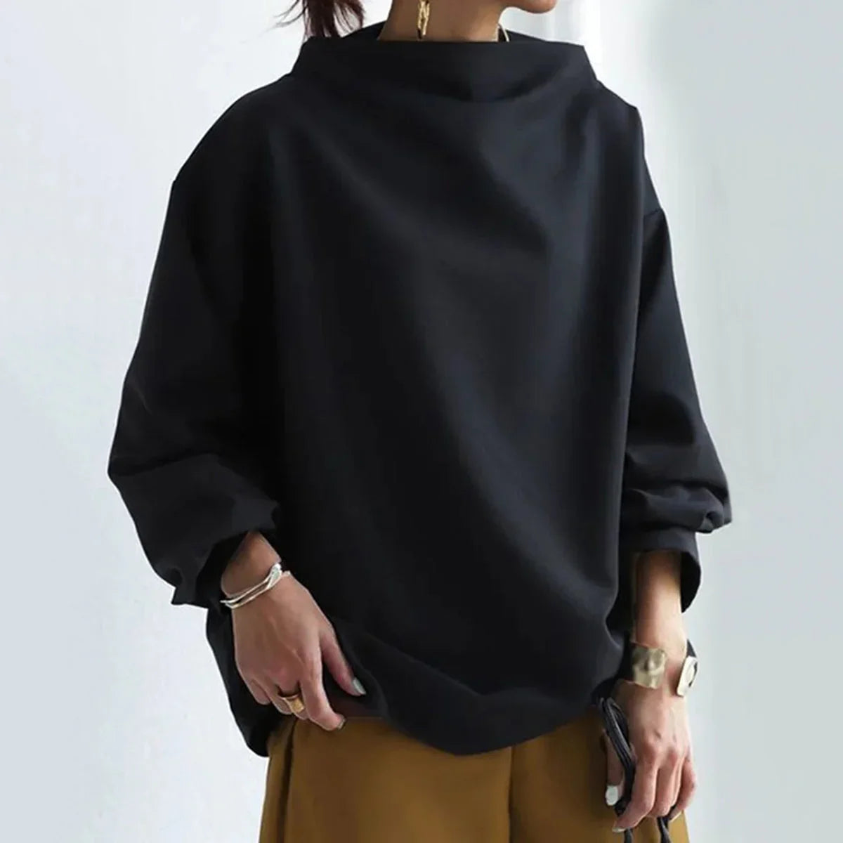 Women's black oversized jumper with mock neckline and long sleeves